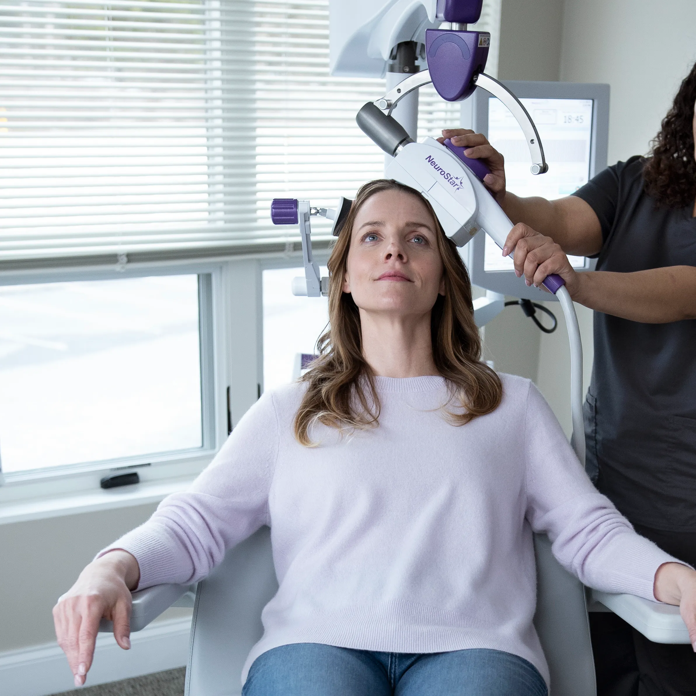 An adult receiving Neurostar® TMS therapy